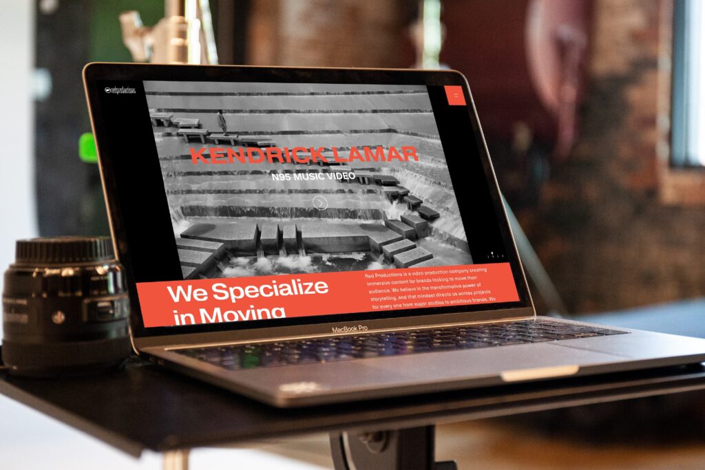 Red Productions website design laptop mockup at the studio featuring kendrick lamar music video