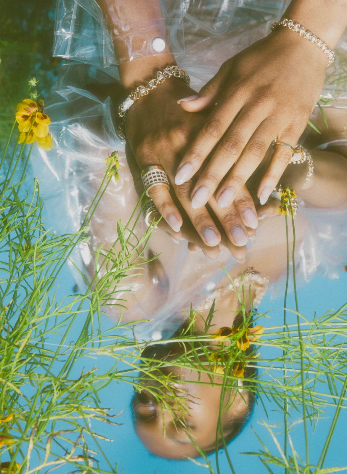 jo latham daydream editorial photography of model in grass with mirror and luxury jewelry for summer campaign