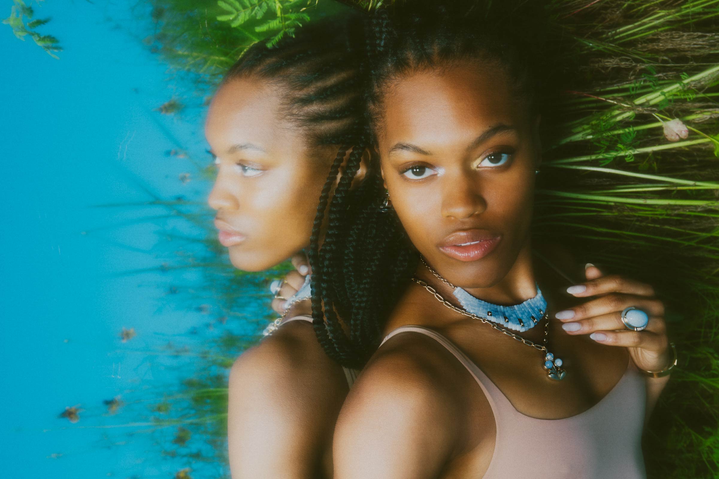 jo latham daydream editorial photography of model in grass with mirror and luxury jewelry for summer campaign