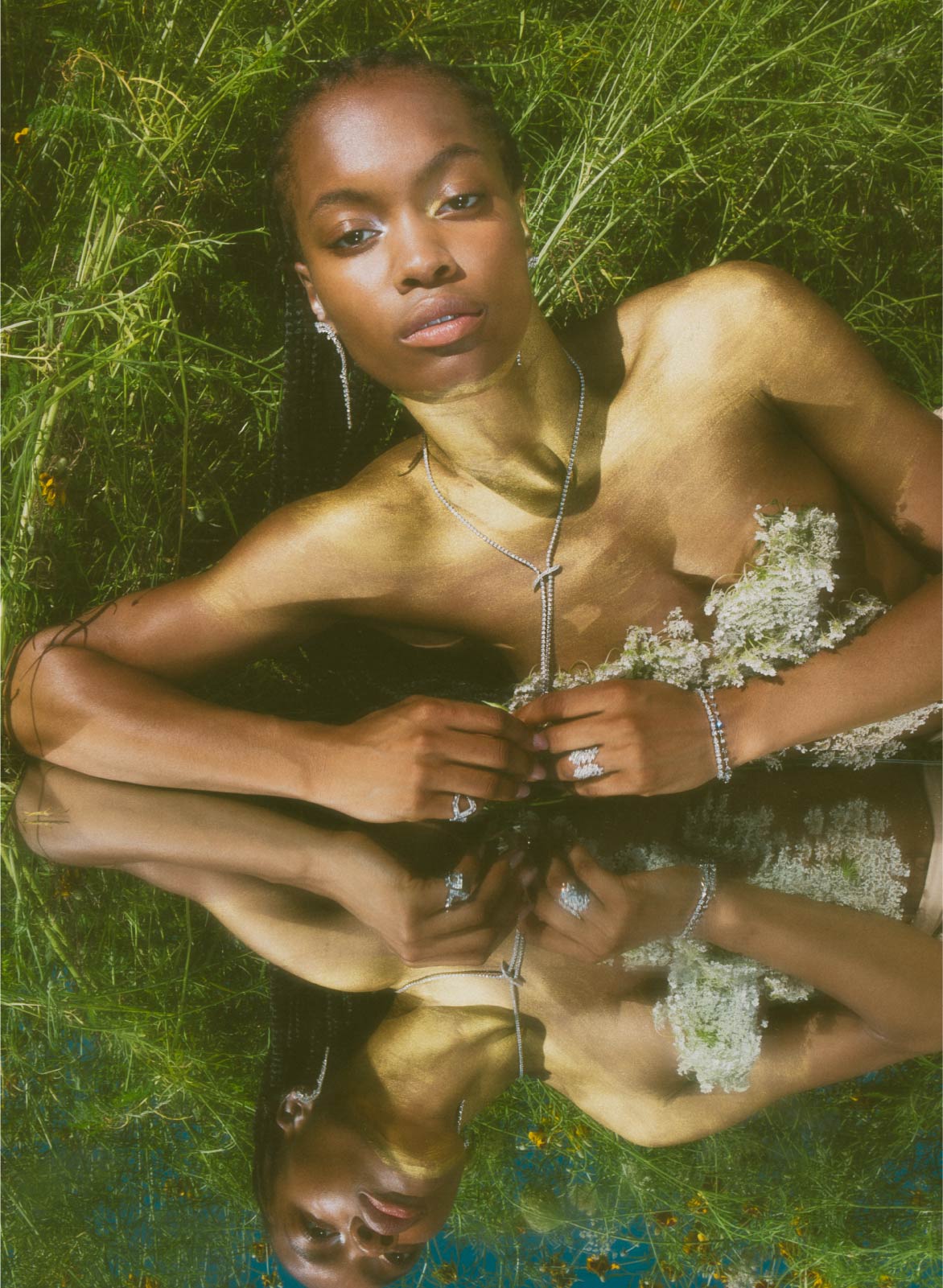 jo latham daydream editorial photography of model in grass with mirror and luxury jewelry for summer campaign