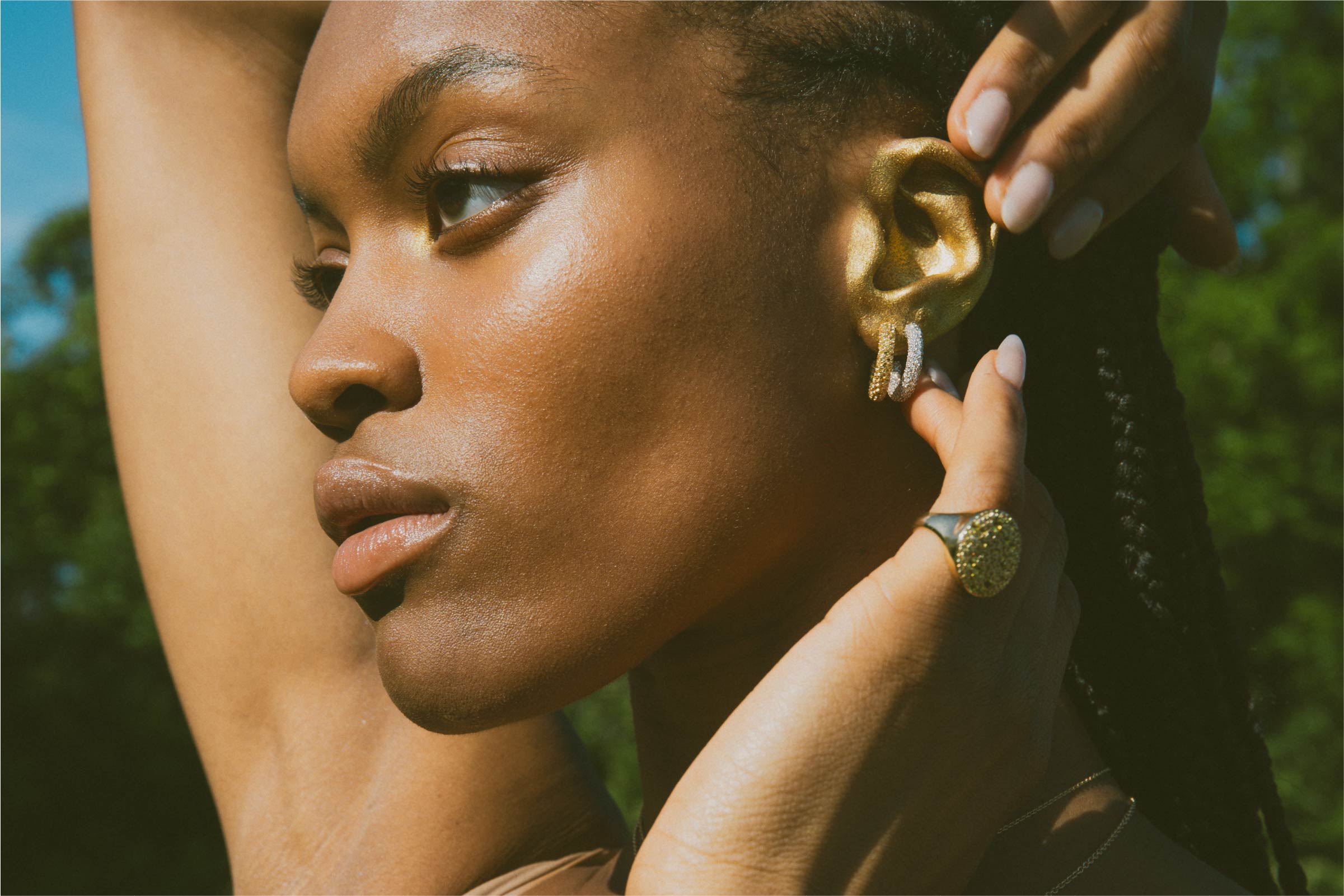 gold ear jo latham daydream editorial photography of model in grass with mirror and luxury jewelry for summer campaign